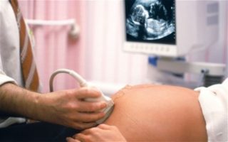 Почему тянет по бокам внизу живота при беременности
